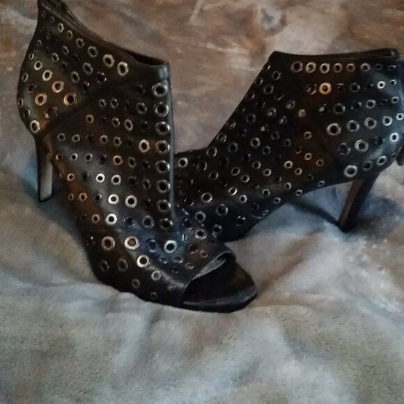 BCBGMAXAZRIA Lange Grommet Peep Toe Bootie in black leather. - Picture 1 of 4